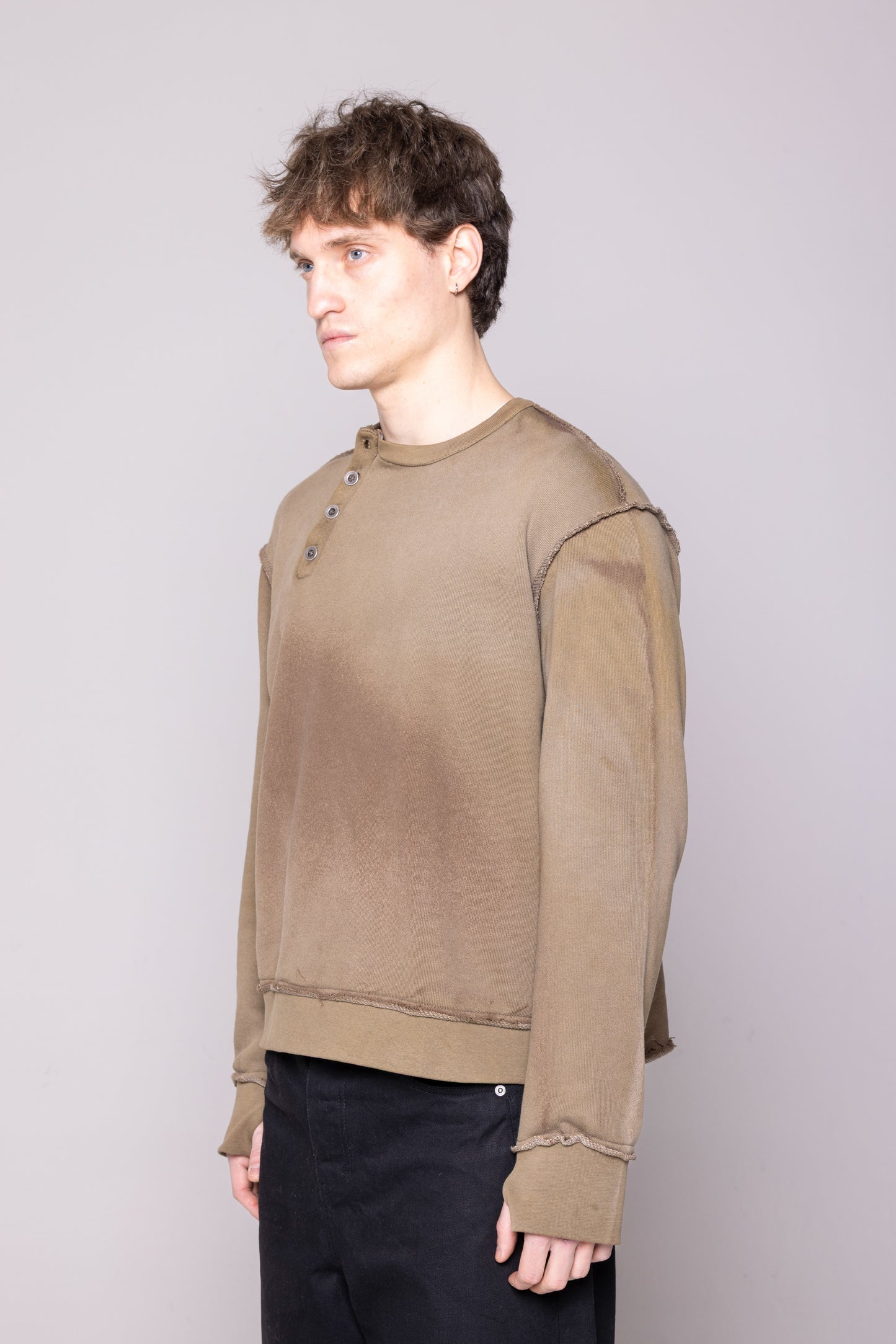 ASYMMETRIC BUTTON CHEST RAW CREWNECK